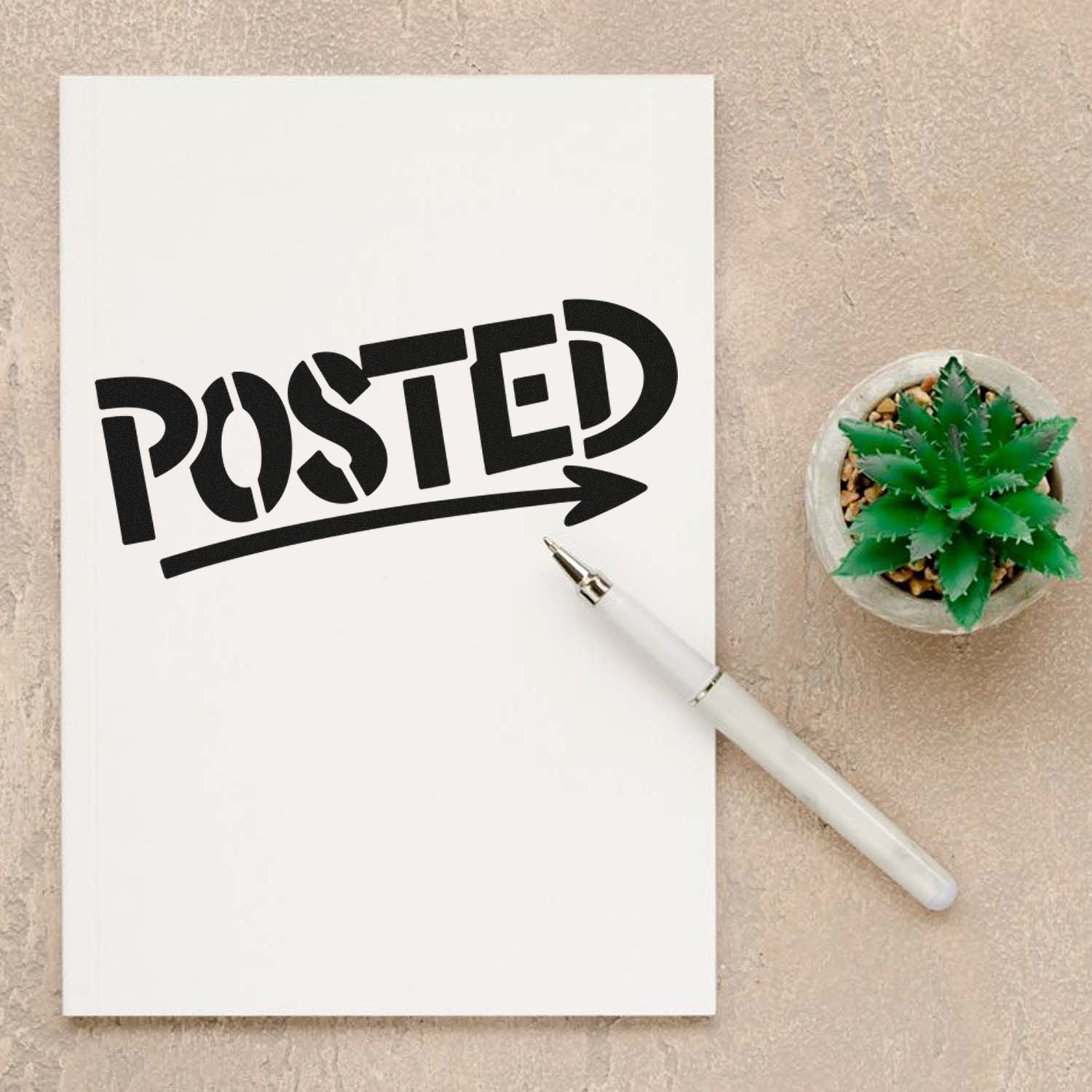 Custom Posted rubber stamp with arrow on notebook, ideal for office mail sorting, packaging, and branding.