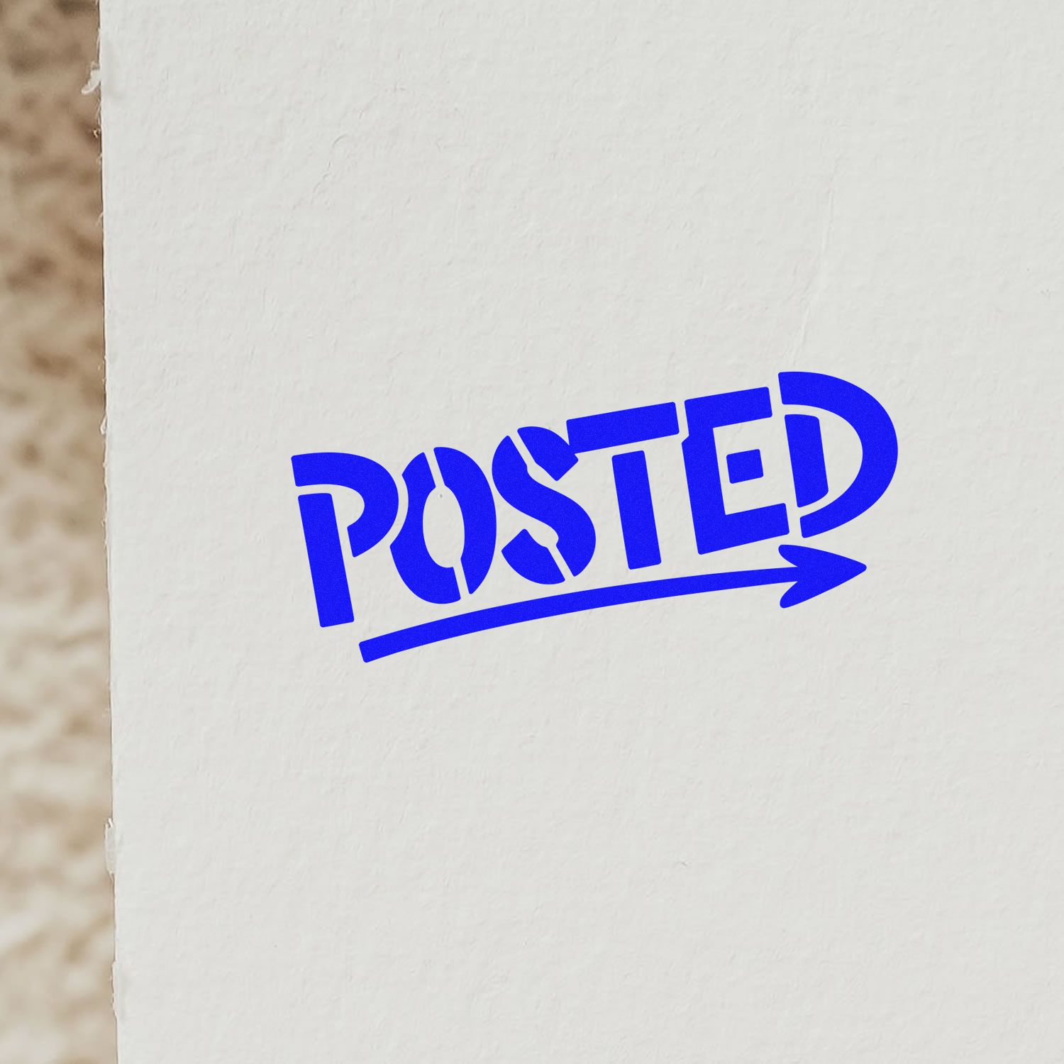 Blue POSTED rubber stamp impression with arrow underline on white paper.