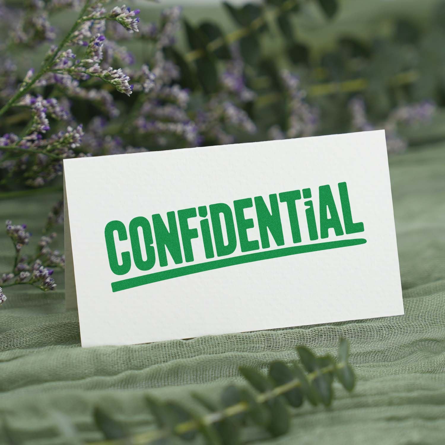 CONFIDENTIAL rubber stamp impression on white card, ideal for document security and office mail labeling