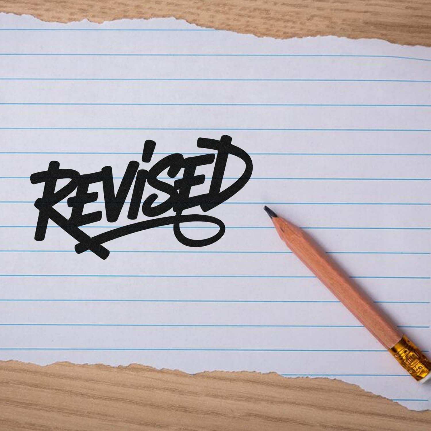 Revised rubber stamp on lined paper, perfect for marking edited documents, office forms, and approval workflows.