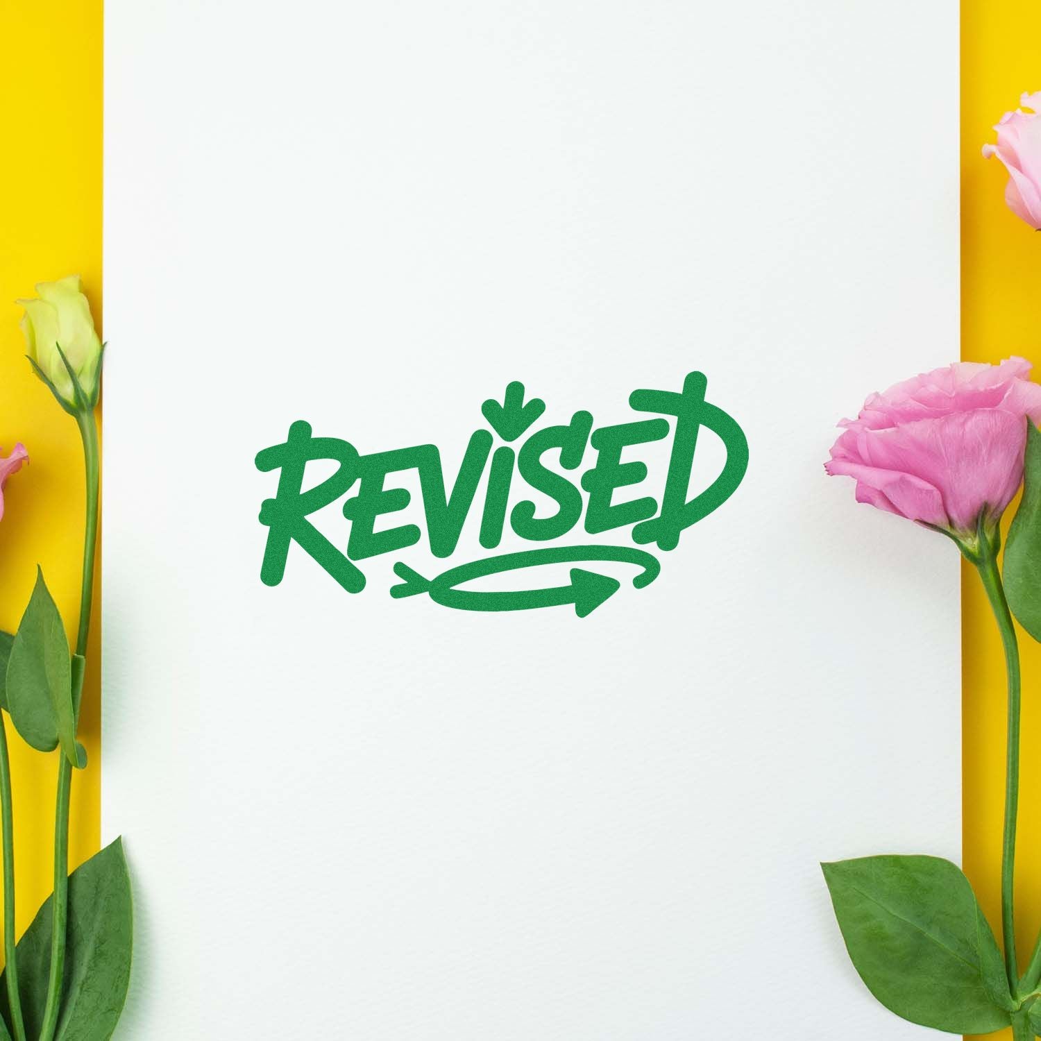Green Revised rubber stamp impression on white paper, ideal for marking updated documents and office paperwork.