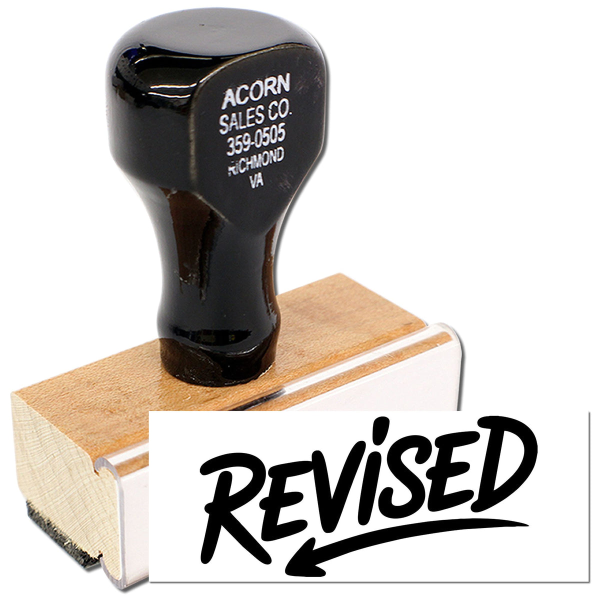 Rubber stamp with REVISED imprint for marking edited documents, proofs, and office paperwork.