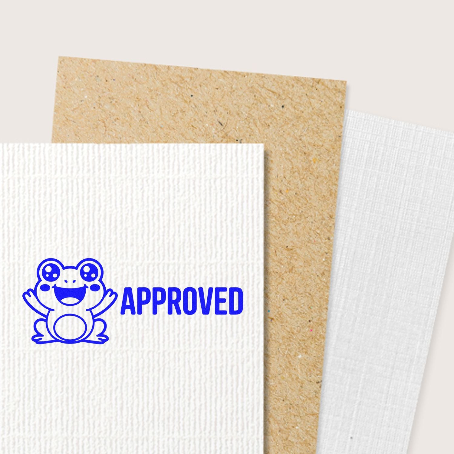 Blue approved frog rubber stamp on textured cardstock, ideal for custom office or craft approval stamping.