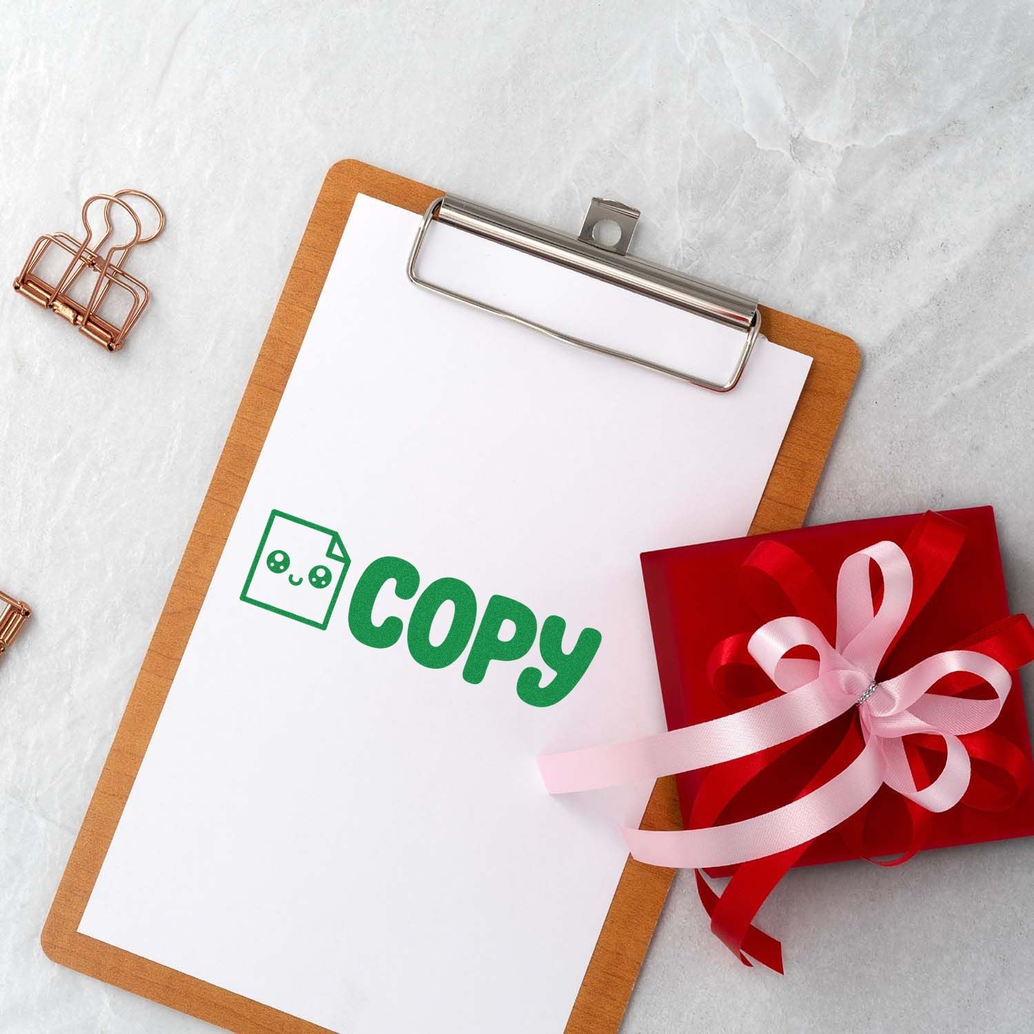 Copy rubber stamp impression on clipboard paper for office document marking and duplicate file identification.