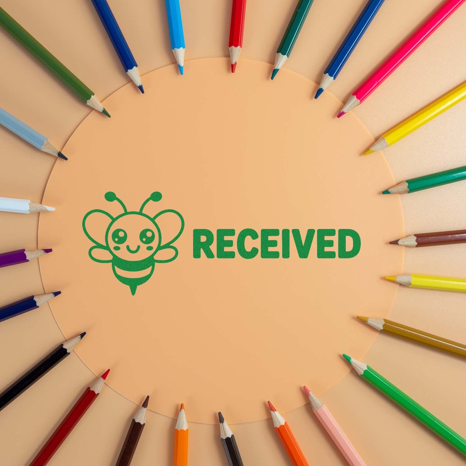 Green RECEIVED rubber stamp with bee icon, framed by colored pencils, for school or office document labeling.