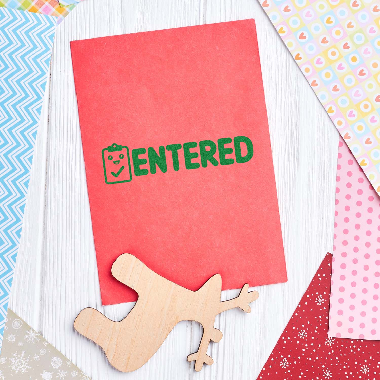 ENTERED rubber stamp impression on red cardstock, ideal for office document approval, filing, and record-keeping.