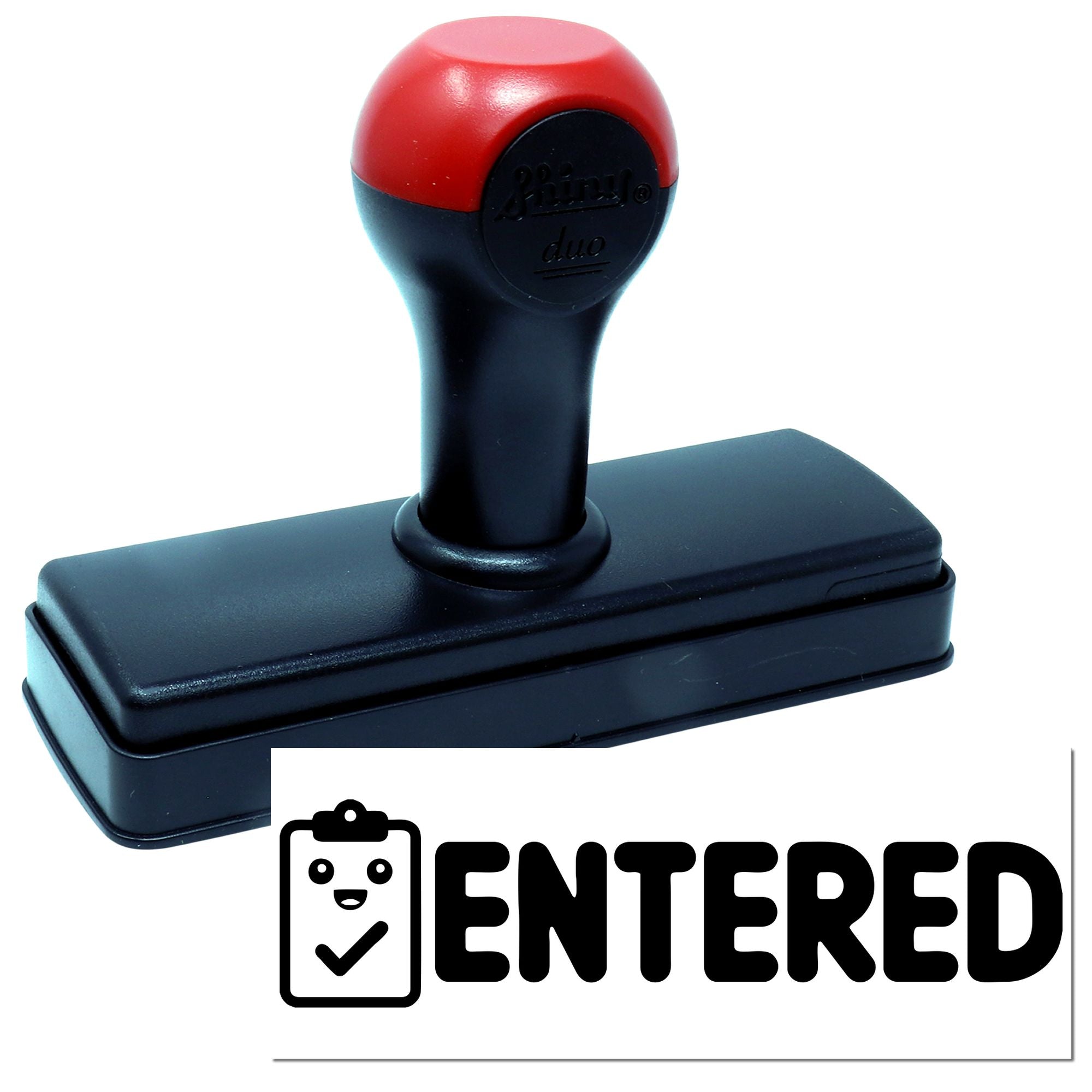 Self-inking rubber stamp with red and black handle and ENTERED imprint for office document processing.