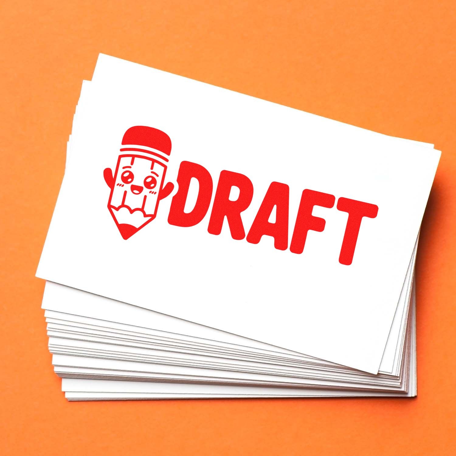 Draft rubber stamp impression on stacked white cards, ideal for document review, proofreading, and office use.