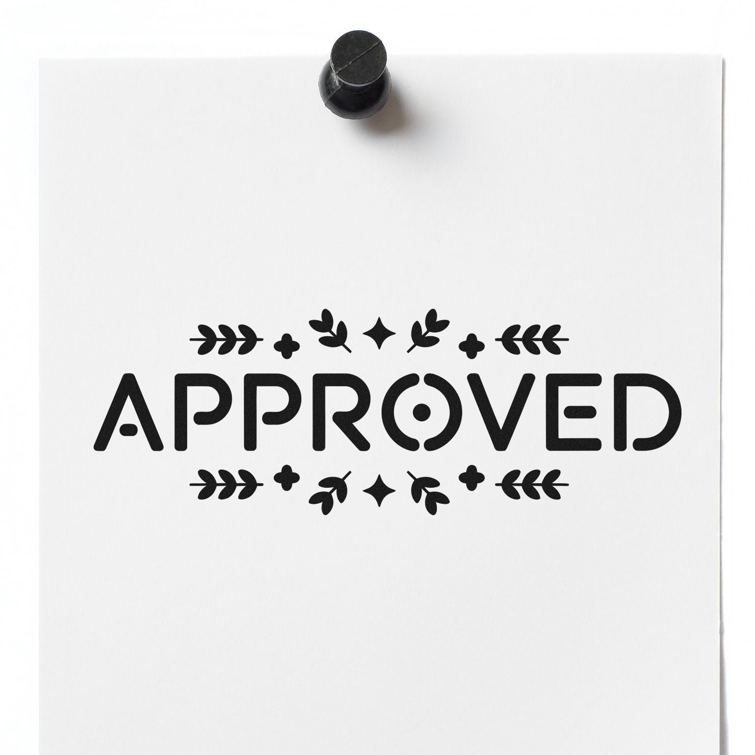 Approved rubber stamp imprint with floral border on white paper document.