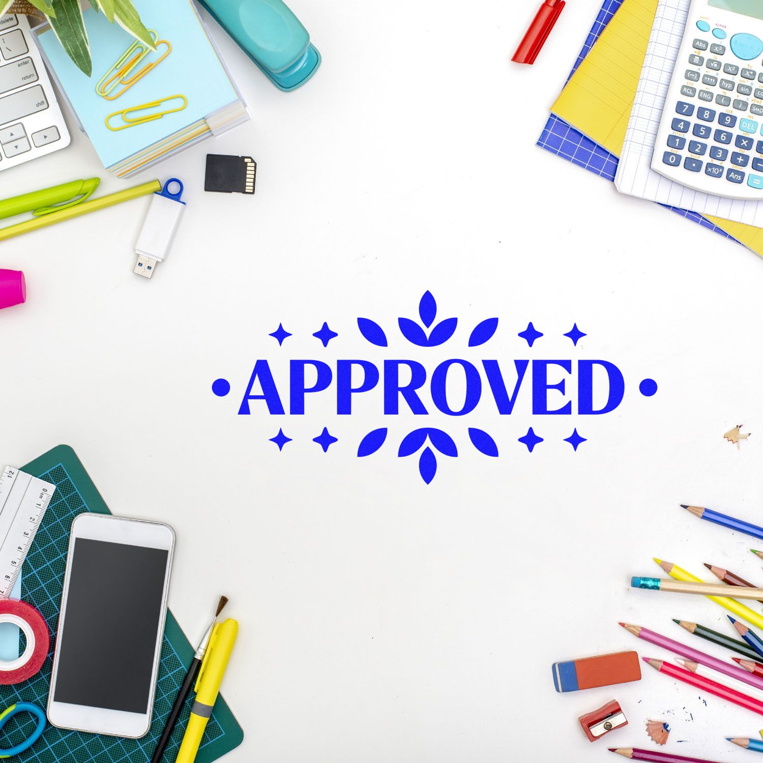 Blue Approved rubber stamp on a white desktop surrounded by office and school supplies for document approval.
