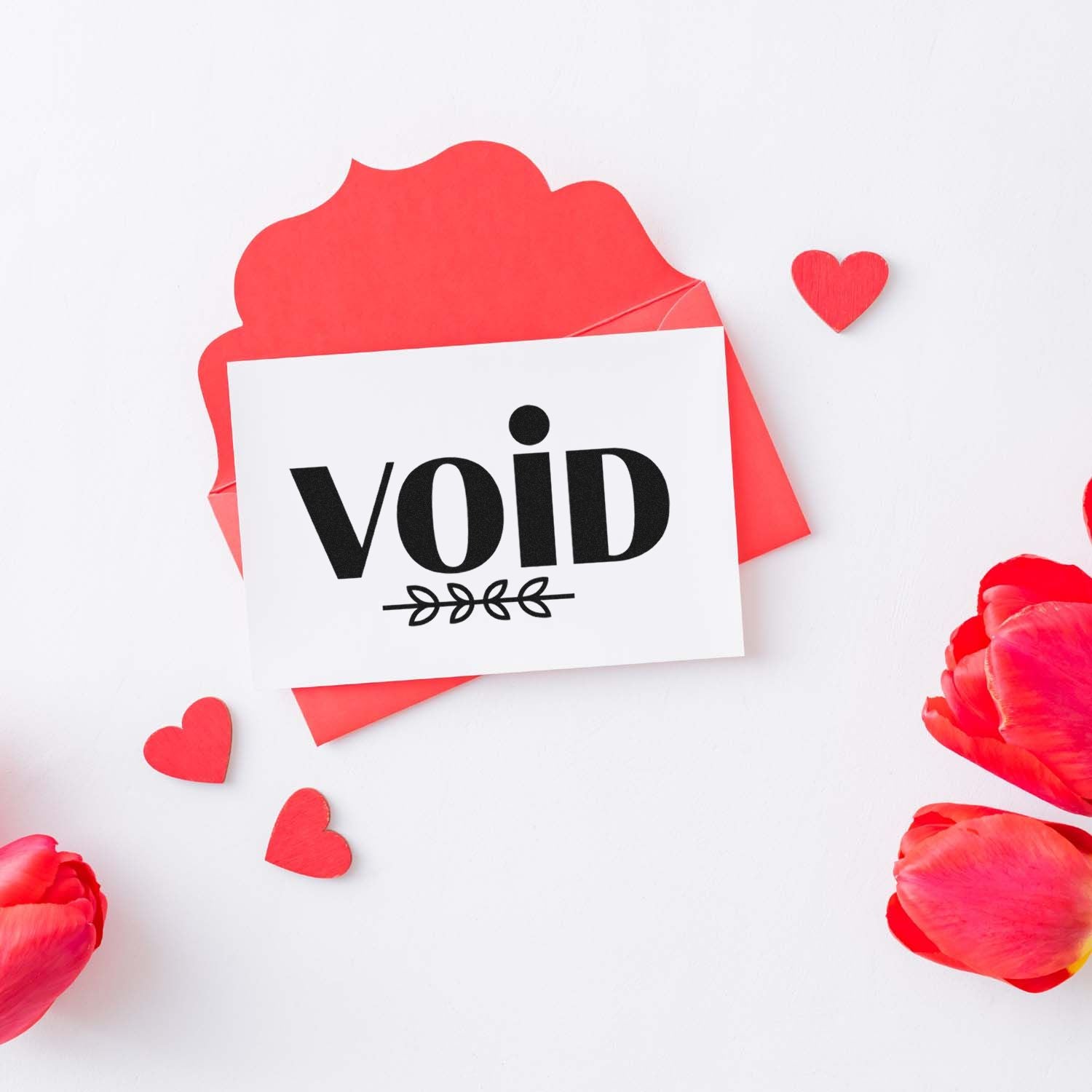 Void rubber stamp impression on card with red heart accents, ideal for packaging, office documents, and business labeling.