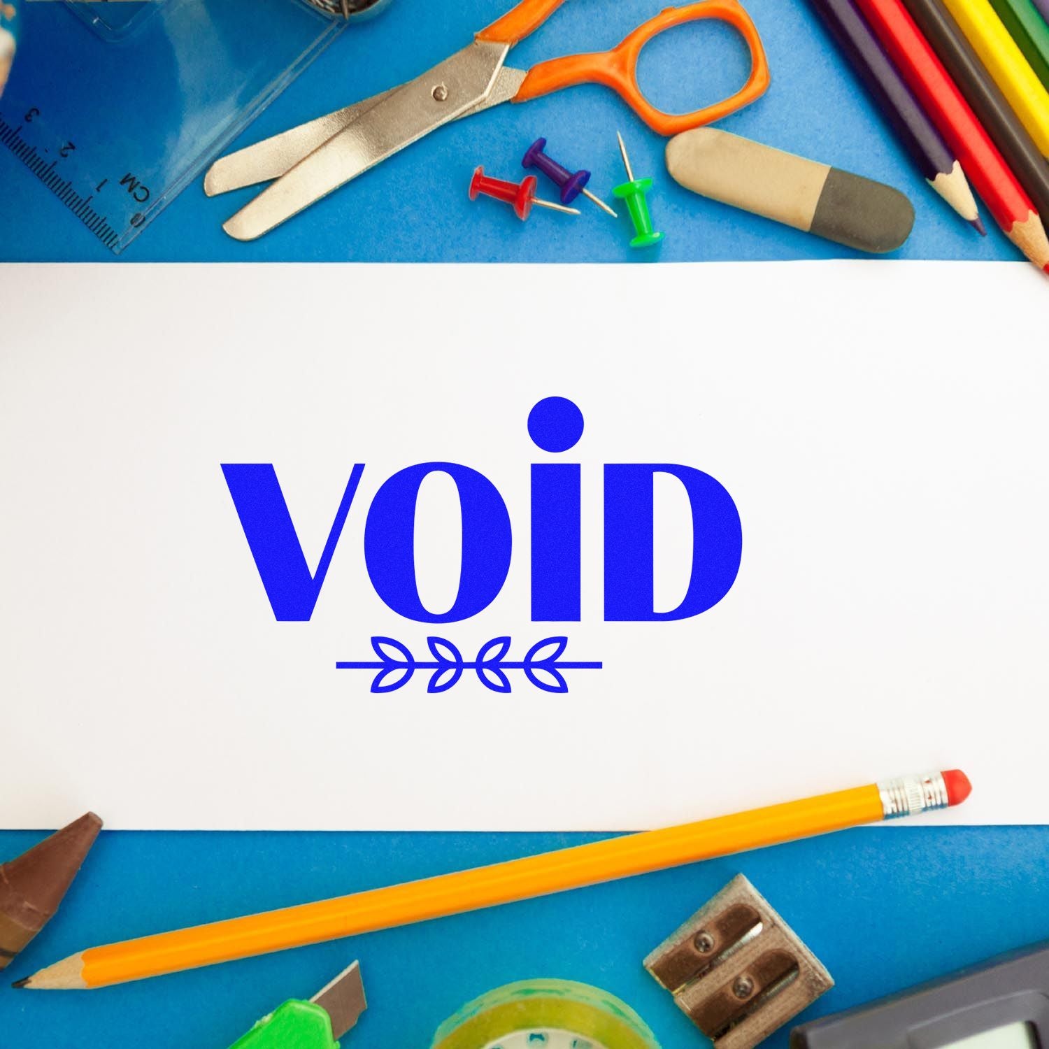 VOID rubber stamp on paper with school supplies, ideal for document marking and office use.