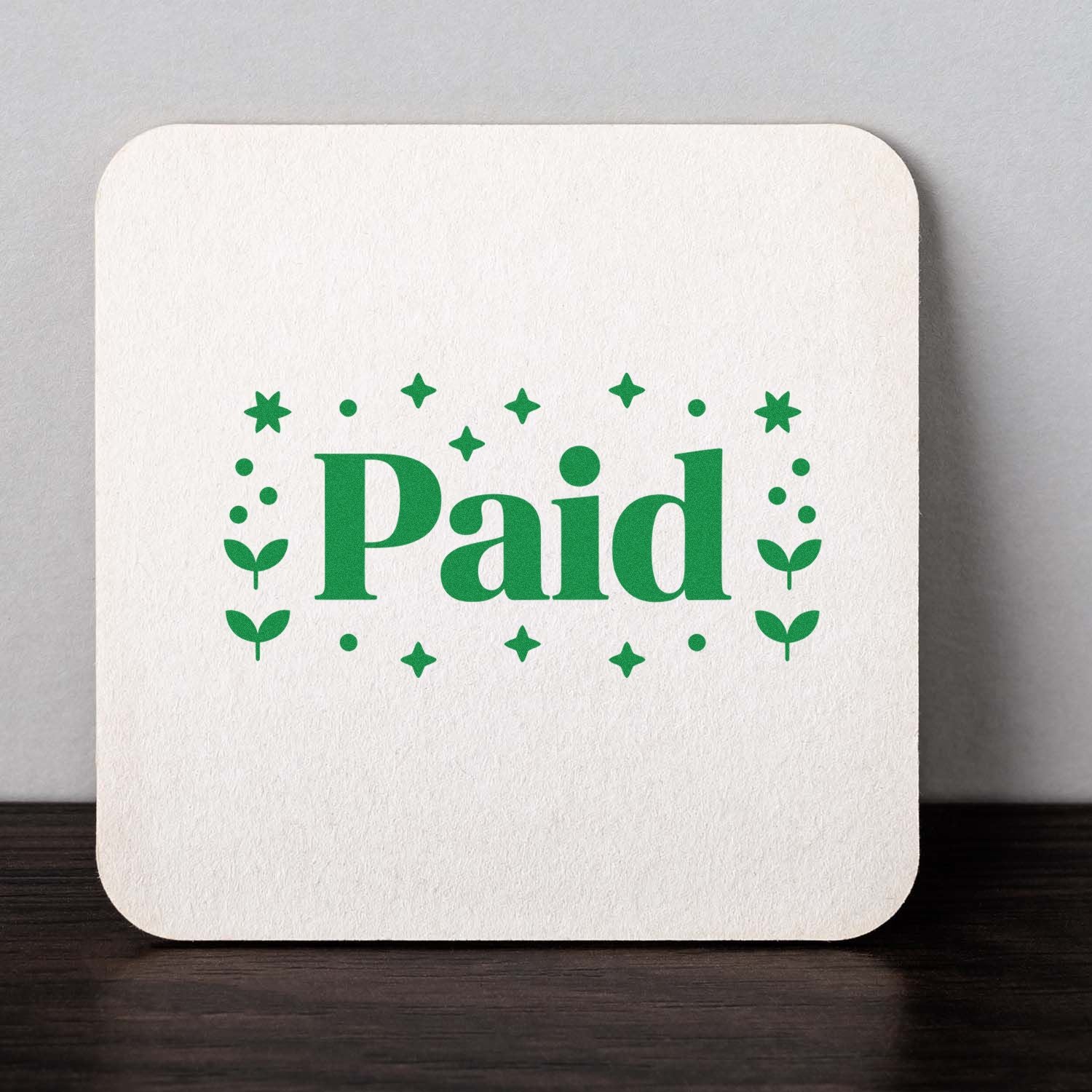 Custom Paid rubber stamp design with decorative stars and dots for office billing, receipts, and bookkeeping.