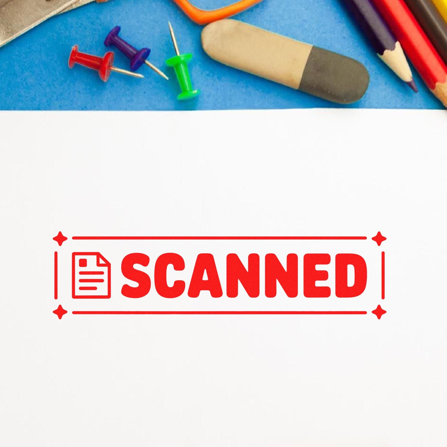 Red SCANNED rubber stamp on paper with office supplies, used to mark documents as digitized and archived.