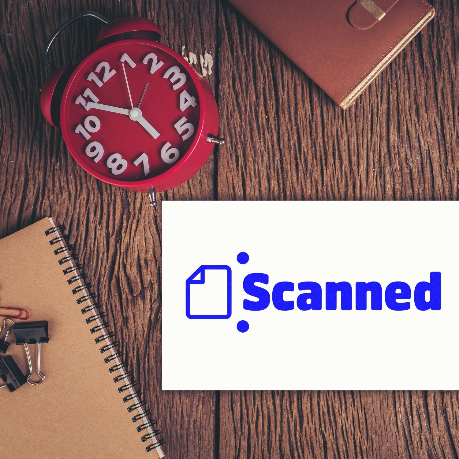 Scanned rubber stamp on a desk, indicating document processing, filing, and office approval workflow.