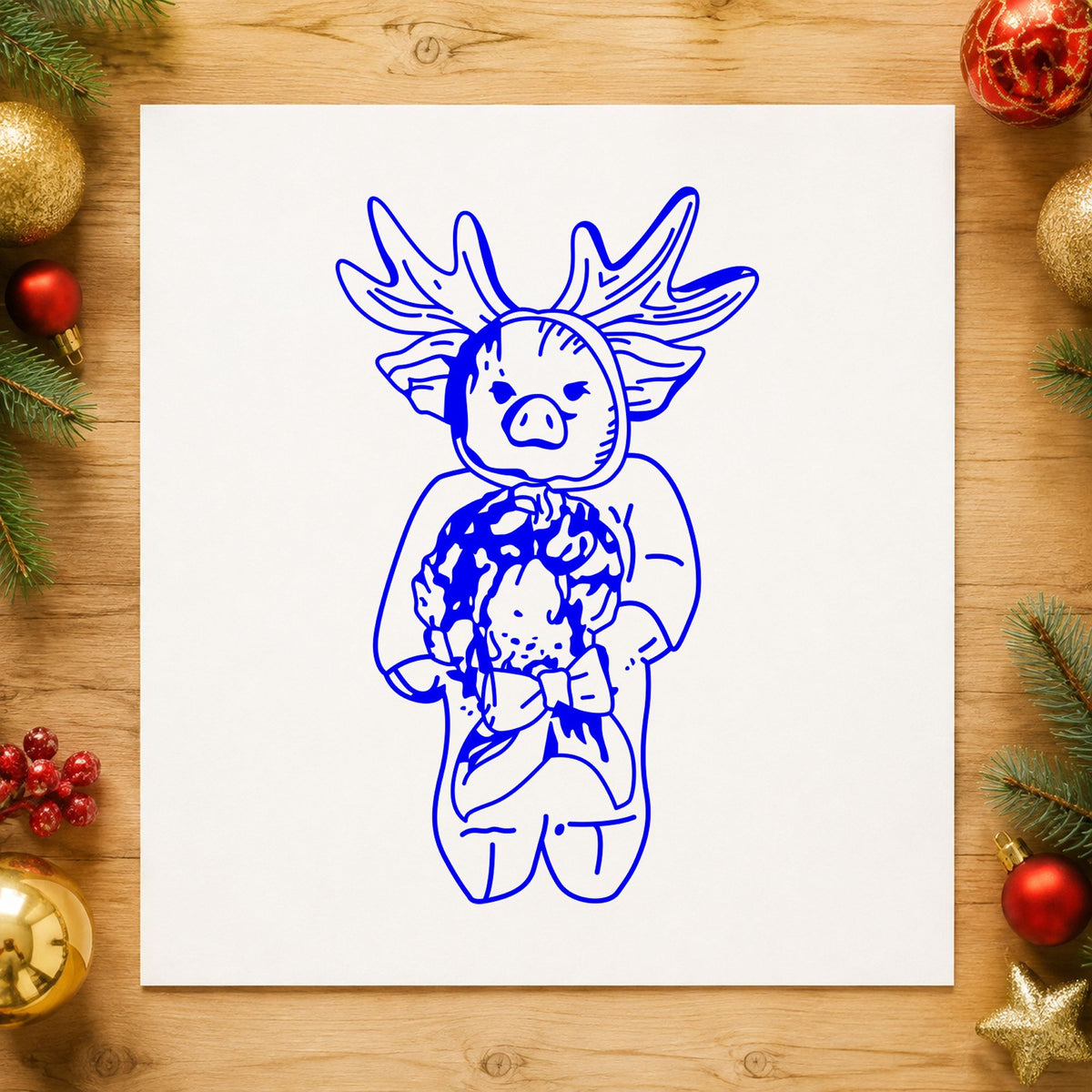 Blue reindeer costume stamp impression featuring the pig in reindeer costume design on white paper.