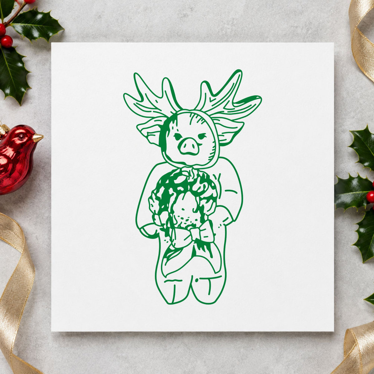 Pig in Reindeer Costume Rubber Stamp impression in green ink on white paper in a styled craft setting.