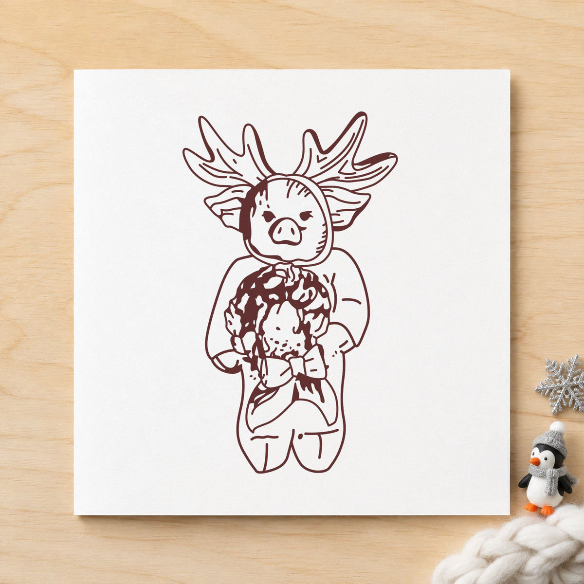Pig in Reindeer Costume Rubber Stamp impression in brown ink on white paper in a styled craft setting.