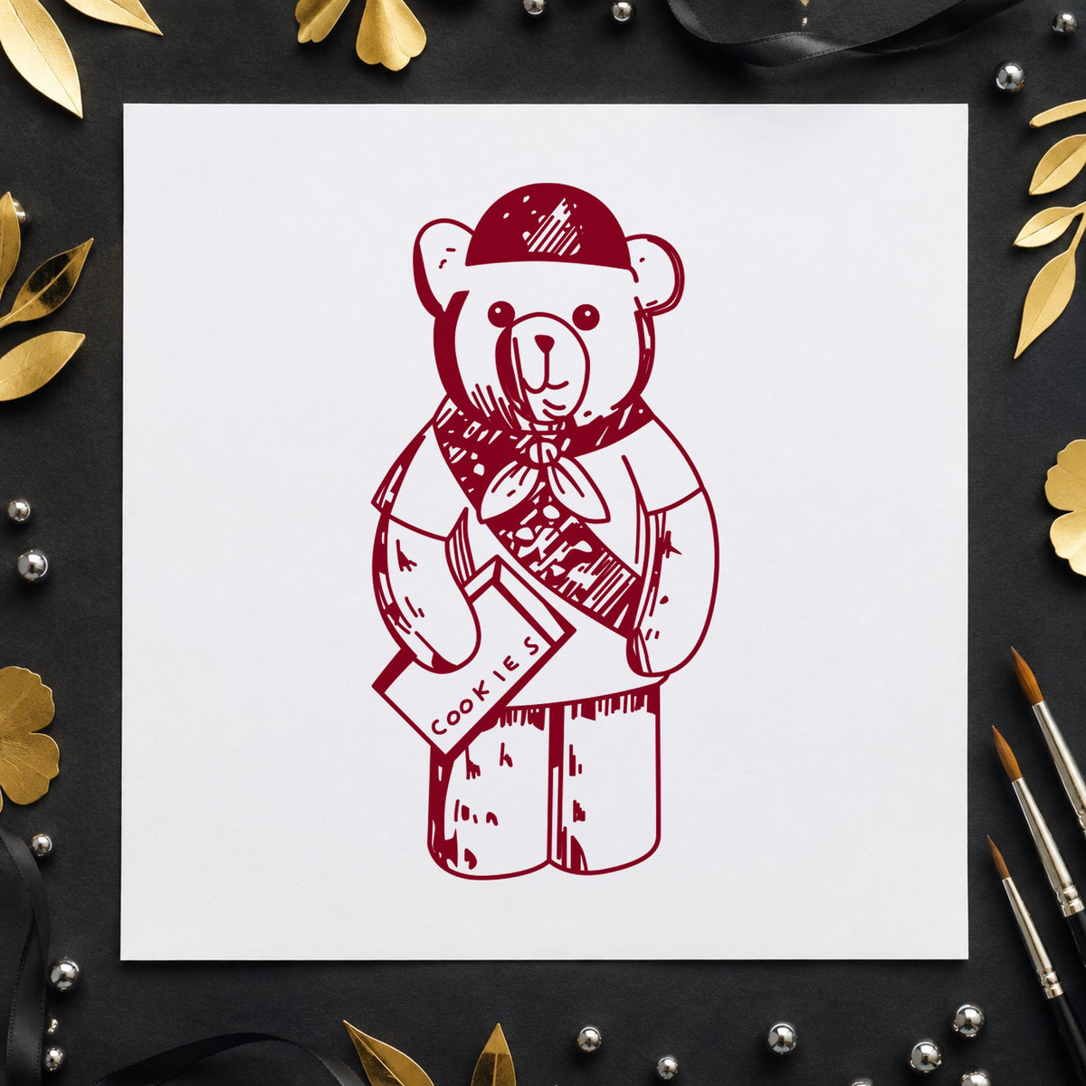 Scout Bear Rubber Stamp impression in burgundy ink on white paper in a styled craft setting.