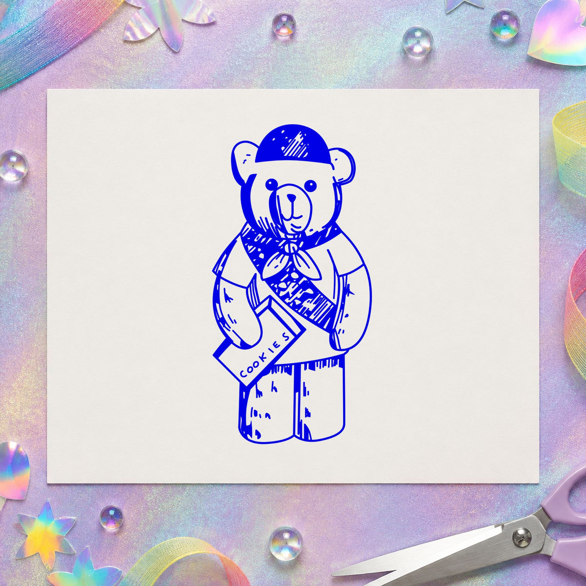 Blue scouting scrapbook stamp impression featuring the scout bear design on white paper.
