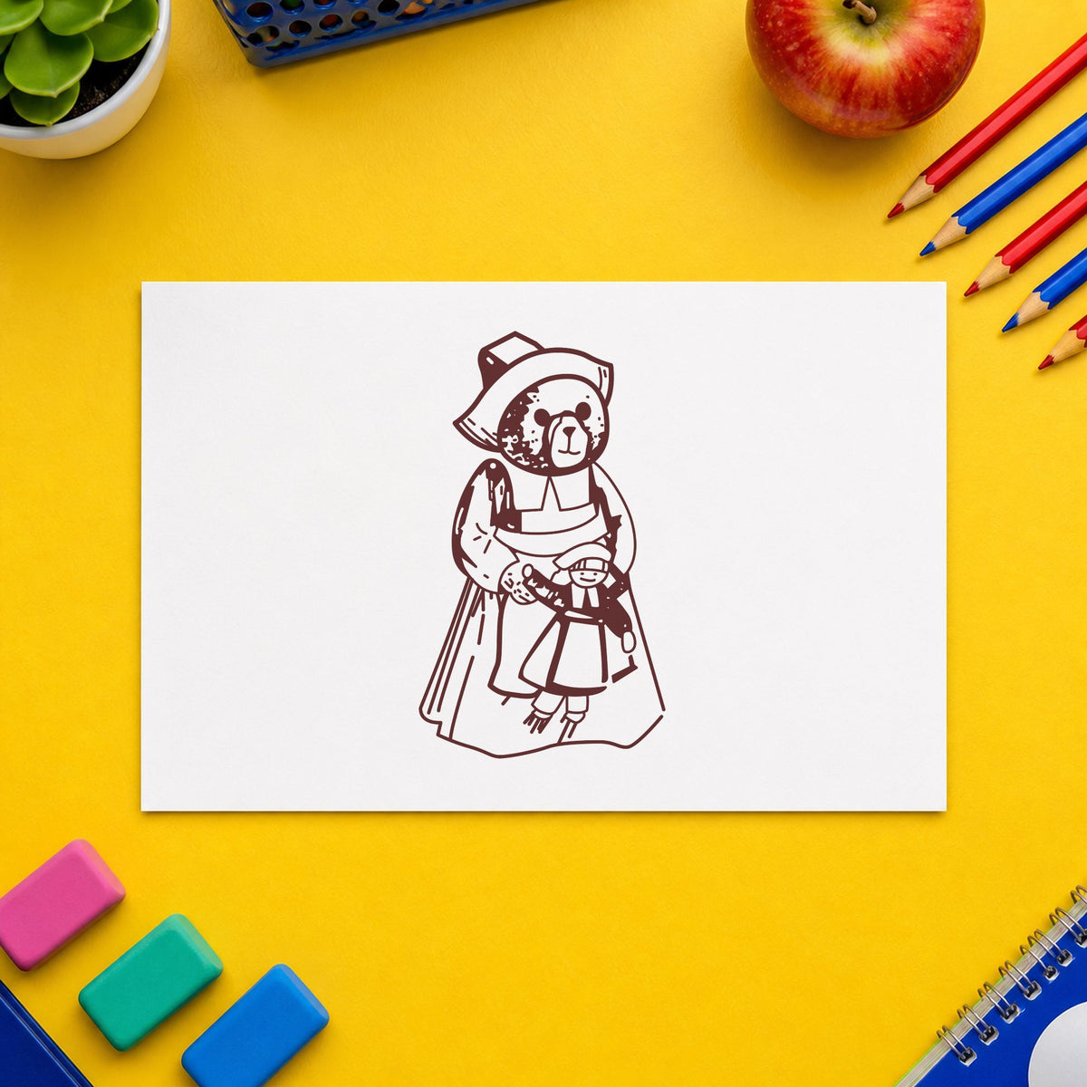 Girl Pilgrim Bear with Doll Rubber Stamp impression in brown ink on white paper in a styled craft setting.