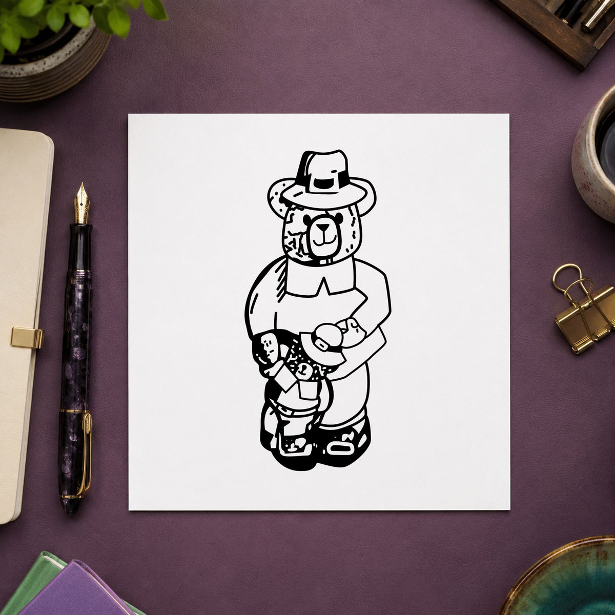 Boy Pilgrim Bear with Teddy Rubber Stamp impression in black ink on white paper in a styled craft setting.