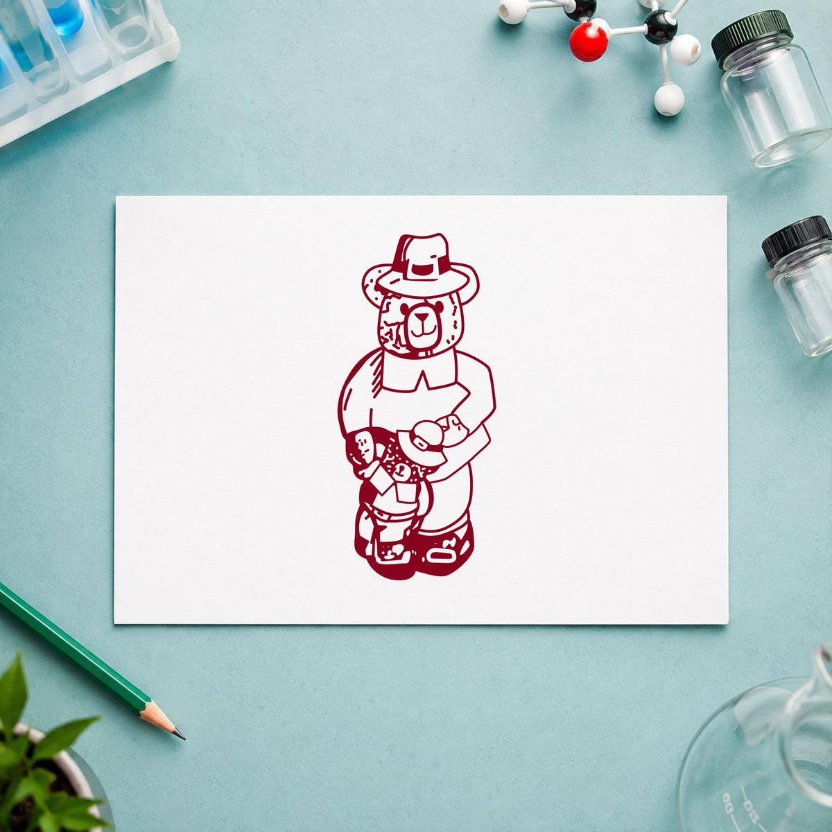 Boy Pilgrim Bear with Teddy Rubber Stamp impression in burgundy ink on white paper in a styled craft setting.