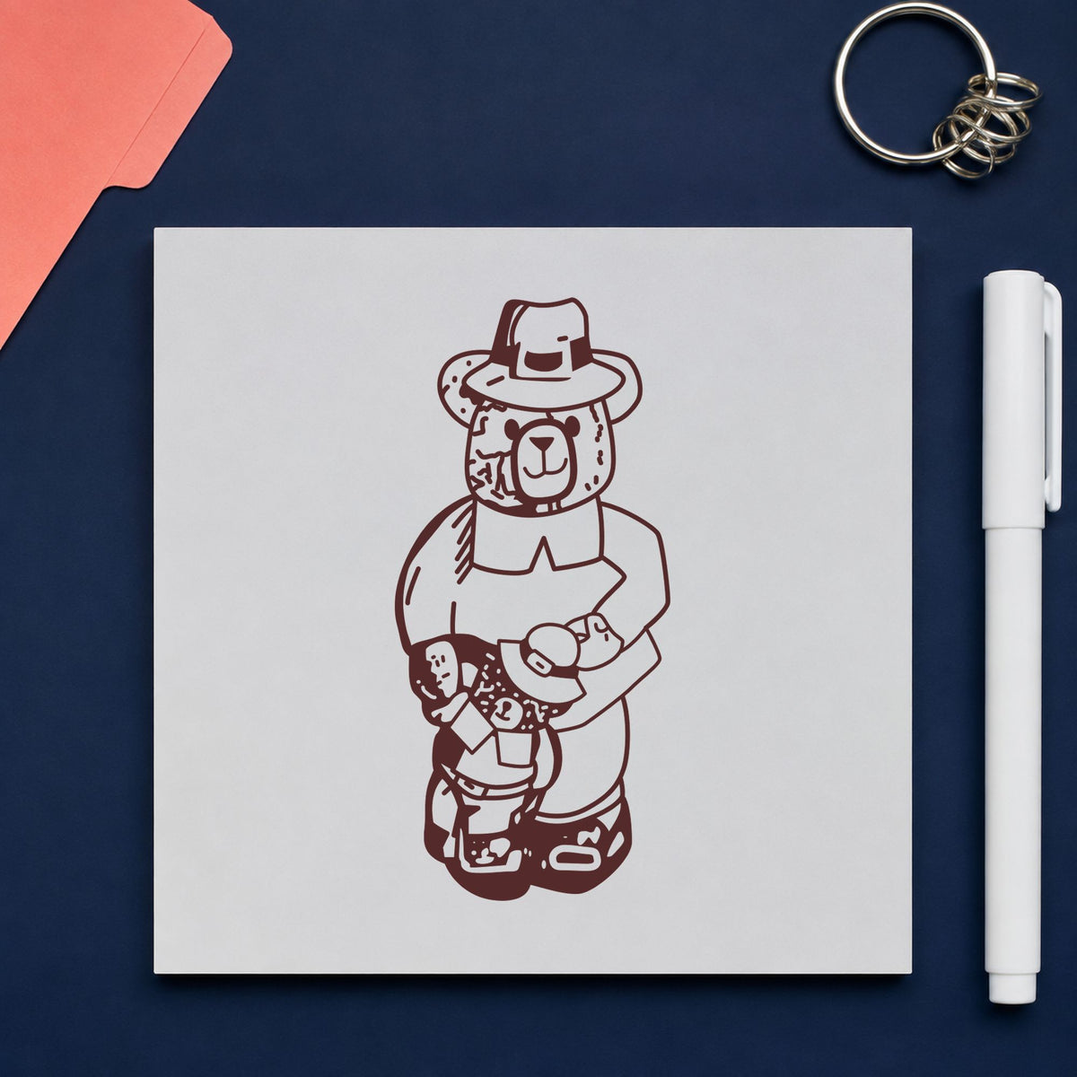 Boy Pilgrim Bear with Teddy Rubber Stamp impression in brown ink on white paper in a styled craft setting.