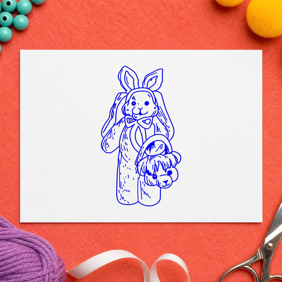 Bunny with Bear Shaped Basket Rubber Stamp impression in blue ink on white paper in a styled craft setting.
