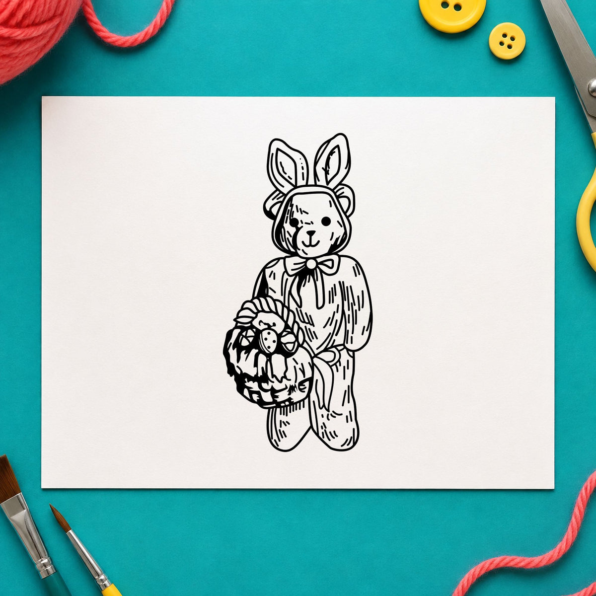 Black impression from a easter bear stamp, featuring the bear in bunny costume with basket design on white paper.