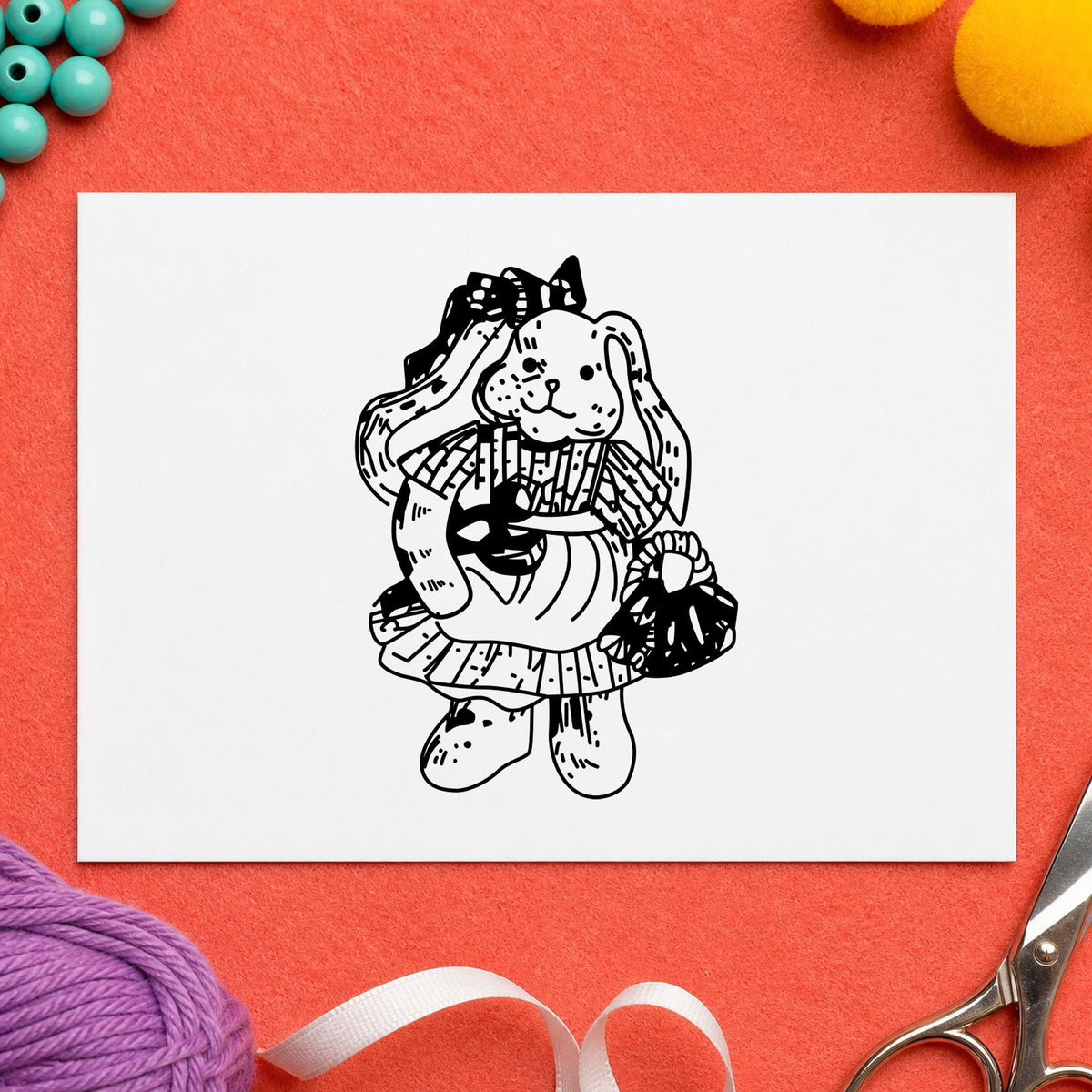 Black impression from a bunny rubber stamp, featuring the country bunny with basket design on white paper.