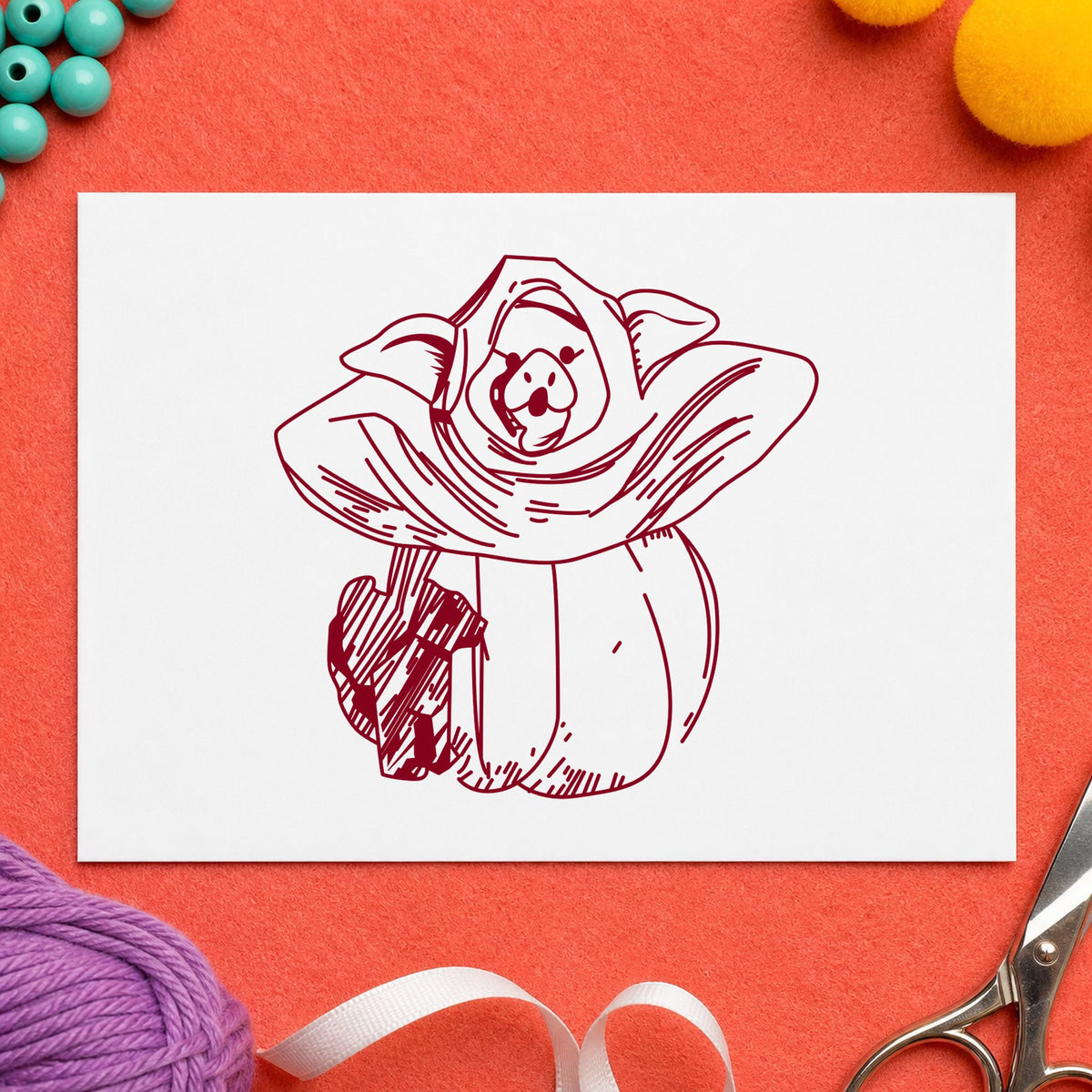 Pumpkin Costume Pig and Black Cat Rubber Stamp impression in burgundy ink on white paper in a styled craft setting.