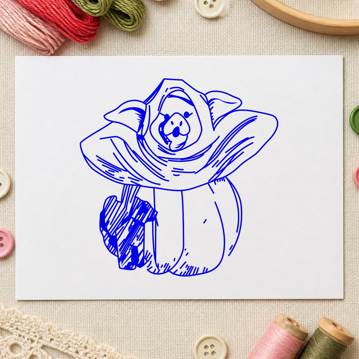 Pumpkin Costume Pig and Black Cat Rubber Stamp impression in blue ink on white paper in a styled craft setting.