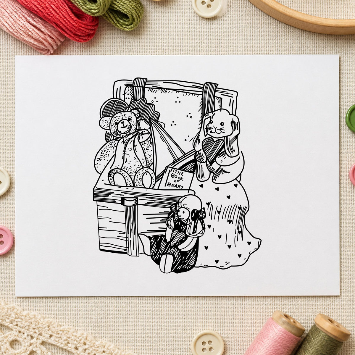 Black impression from a toy box stamp, featuring the toy box with bear and bunny design on white paper.
