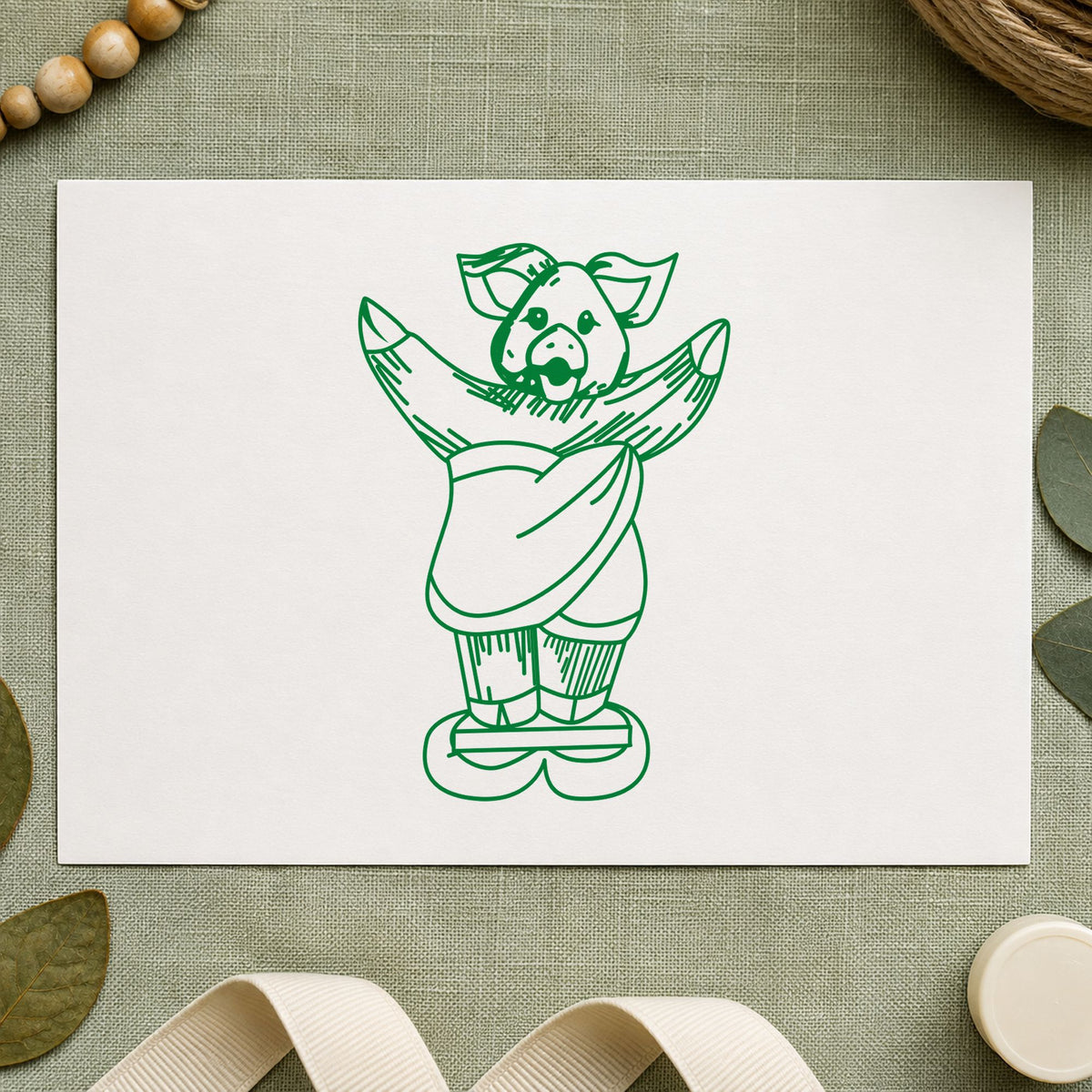 Pig on Bathroom Scales Rubber Stamp impression in green ink on white paper in a styled craft setting.