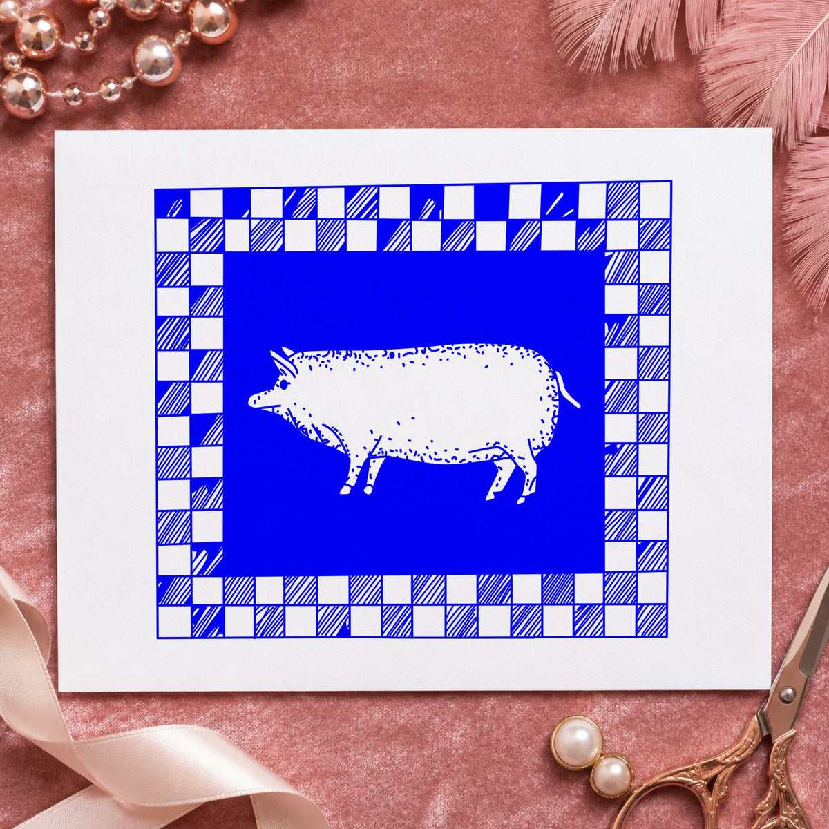 Blue checkered border stamp impression featuring the pig with checkered border design on white paper.