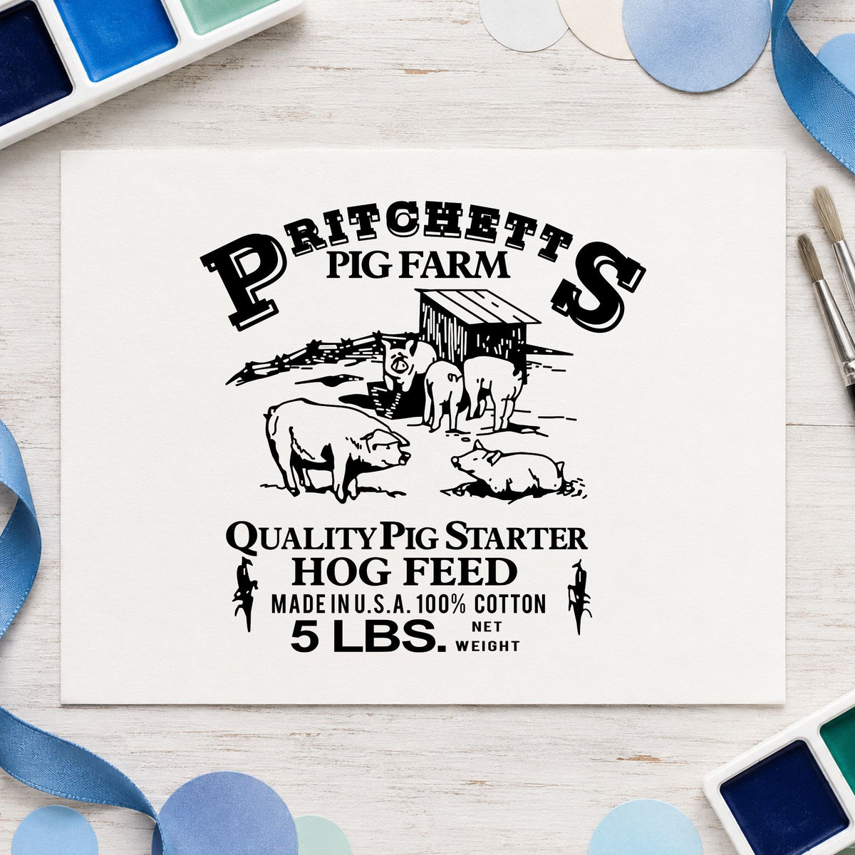 Black impression from a farm label stamp, featuring the hog feed label design on white paper.