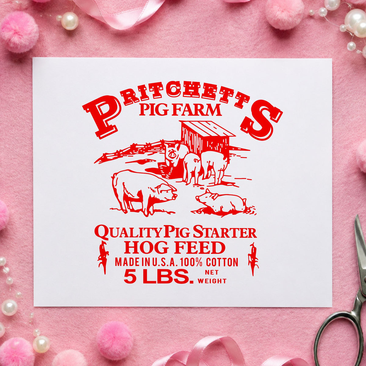 Hog Feed Label Rubber Stamp impression in red ink on white paper in a styled craft setting.