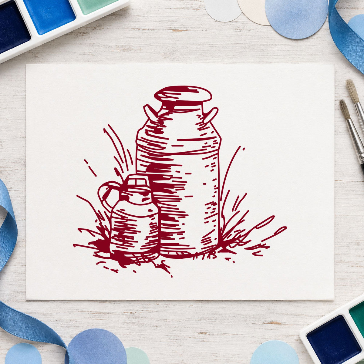 Two Milk Cans Rubber Stamp impression in burgundy ink on white paper in a styled craft setting.