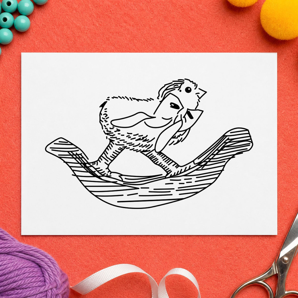 Rocking Chicken with Bow Rubber Stamp impression in black ink on white paper in a styled craft setting.