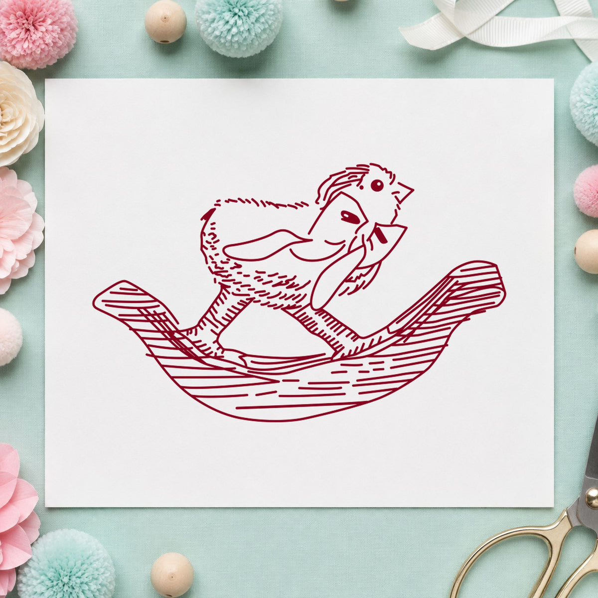 Rocking Chicken with Bow Rubber Stamp impression in burgundy ink on white paper in a styled craft setting.
