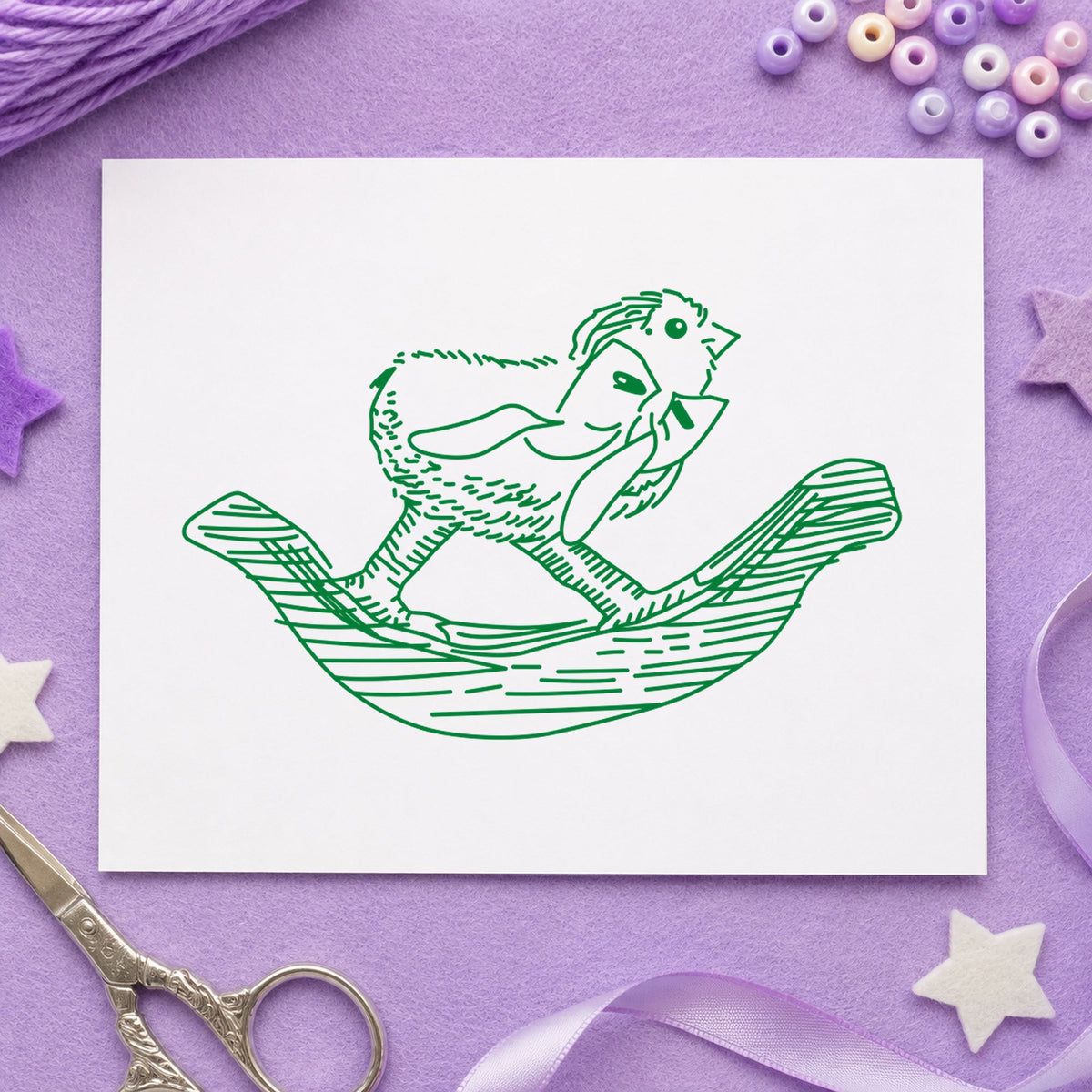 Rocking Chicken with Bow Rubber Stamp impression in green ink on white paper in a styled craft setting.