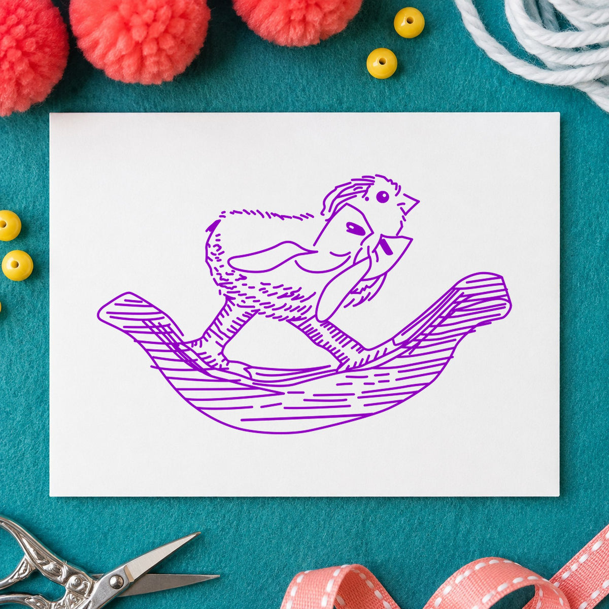 Rocking Chicken with Bow Rubber Stamp impression in purple ink on white paper in a styled craft setting.