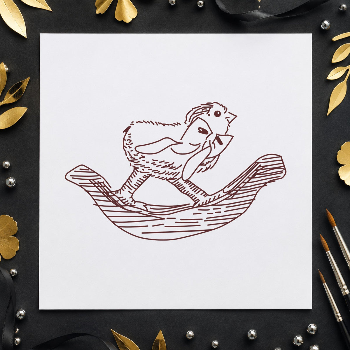 Rocking Chicken with Bow Rubber Stamp impression in brown ink on white paper in a styled craft setting.