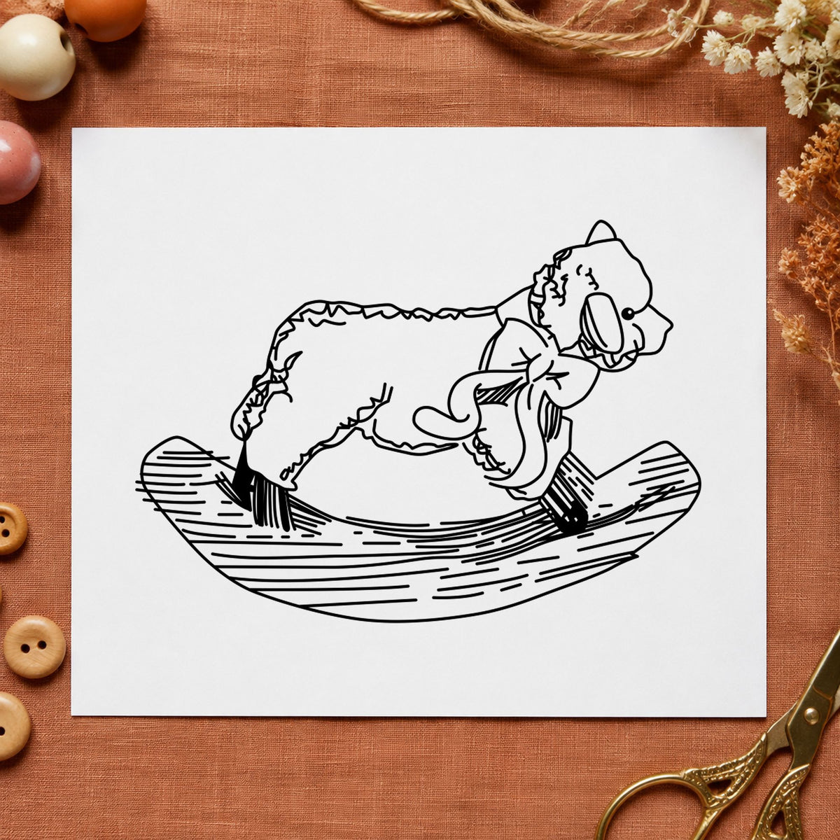 Rocking Sheep Rubber Stamp impression in black ink on white paper in a styled craft setting.
