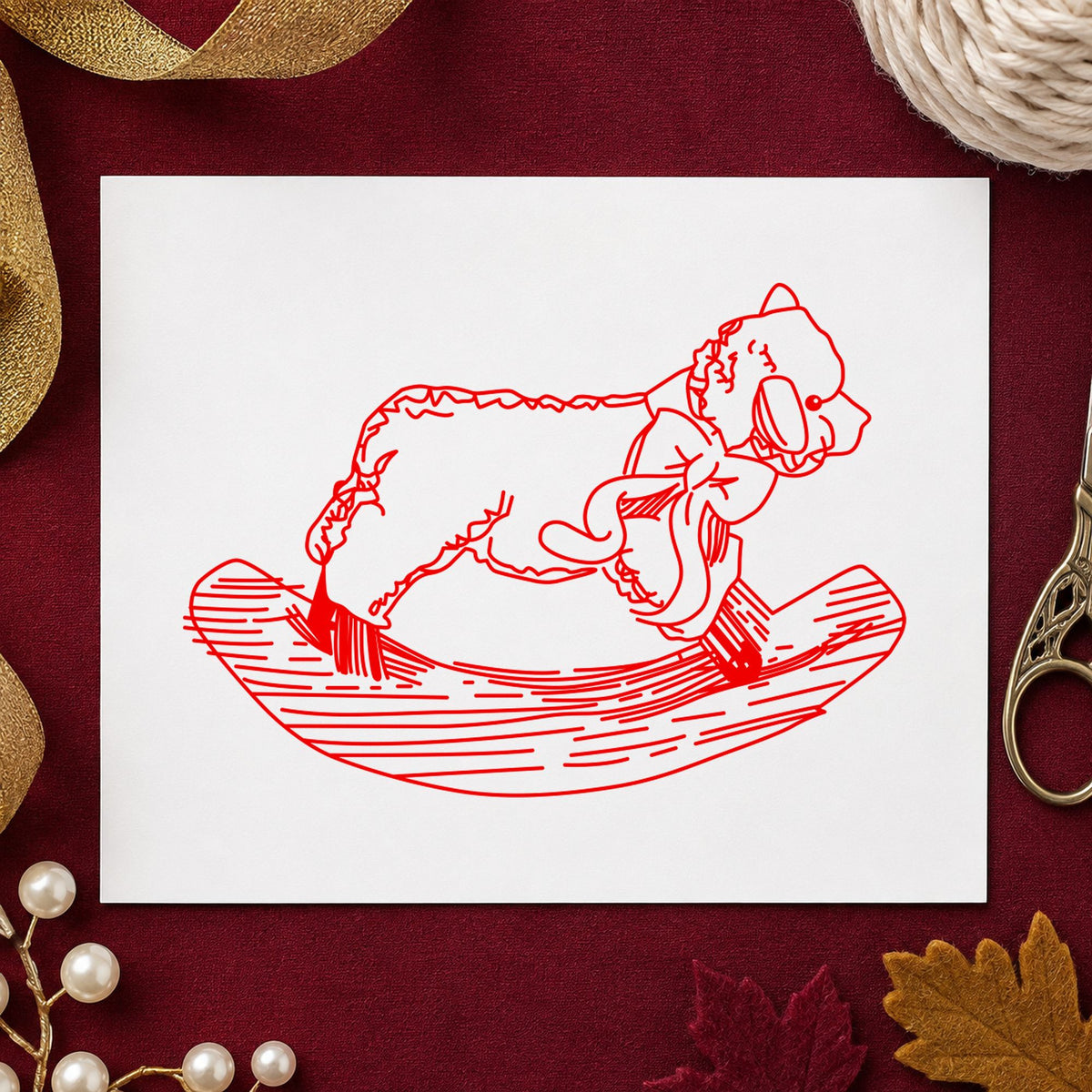 Rocking Sheep Rubber Stamp impression in red ink on white paper in a styled craft setting.