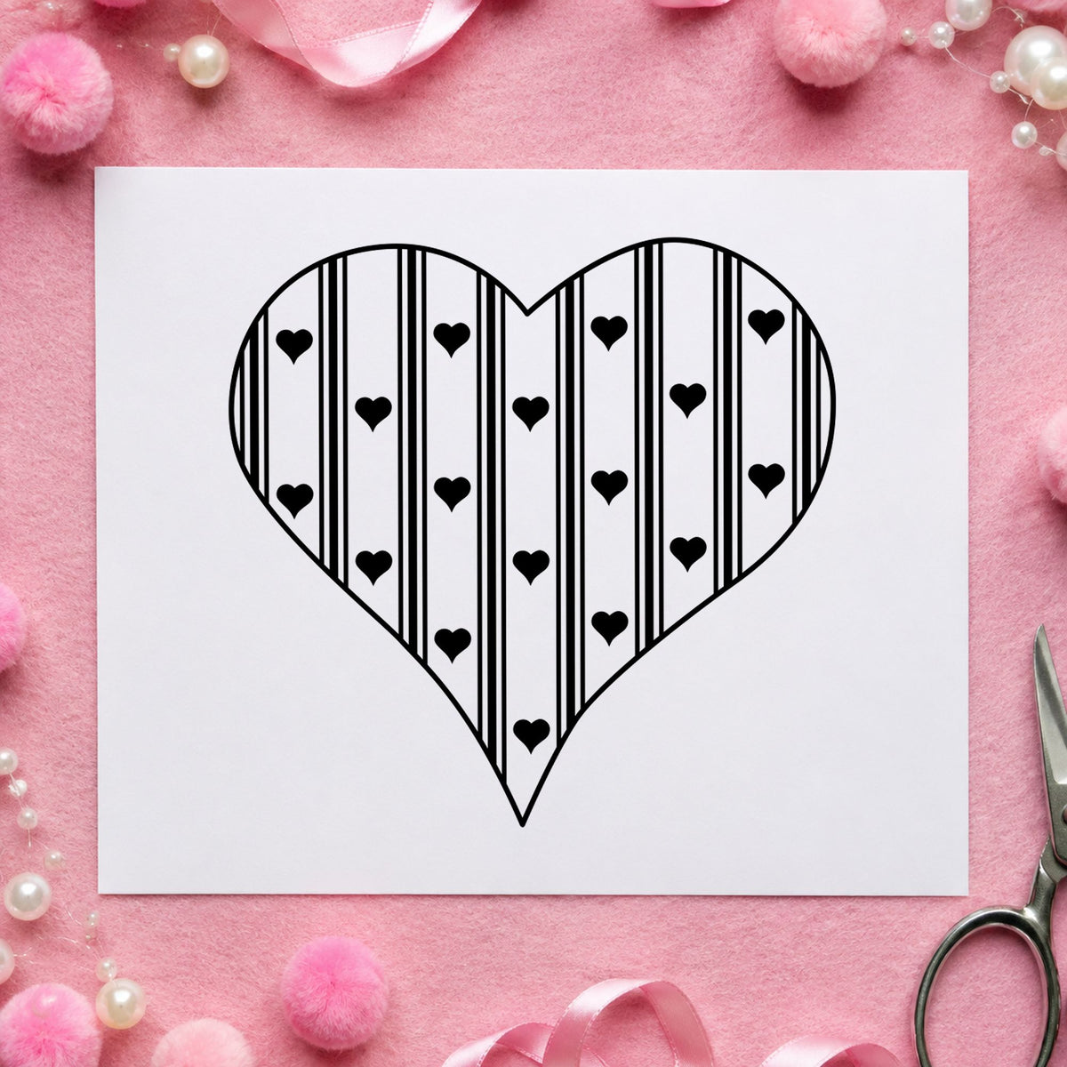 Black impression from a heart rubber stamp, featuring the striped country heart design on white paper.