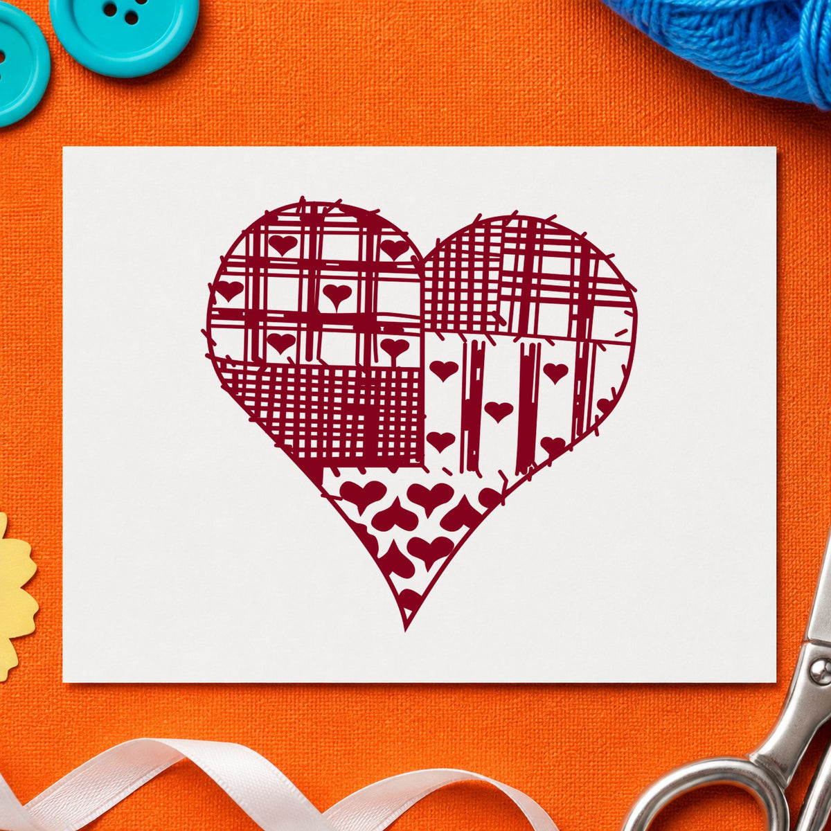 Patchwork Country Heart Rubber Stamp impression in burgundy ink on white paper in a styled craft setting.