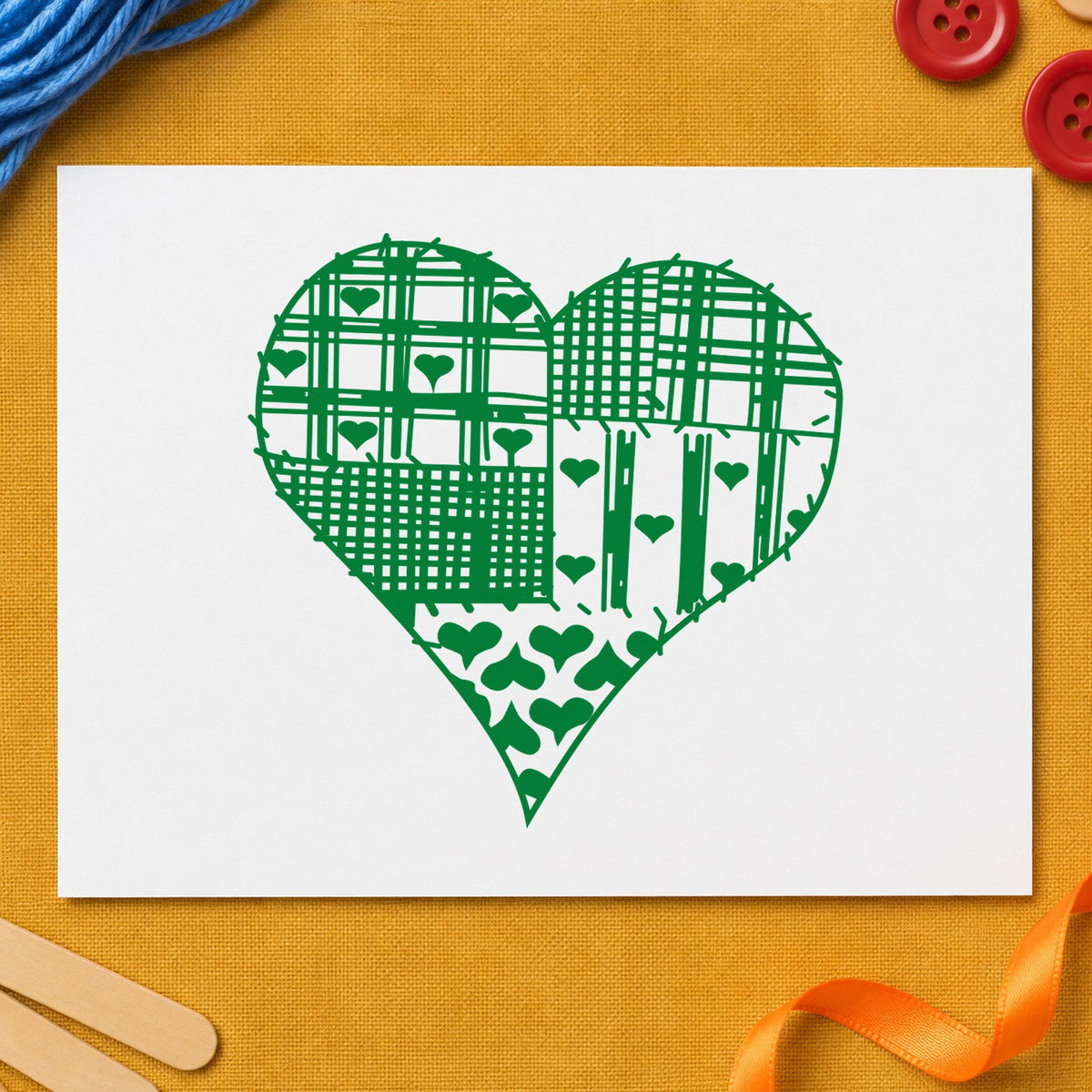 Patchwork Country Heart Rubber Stamp impression in green ink on white paper in a styled craft setting.