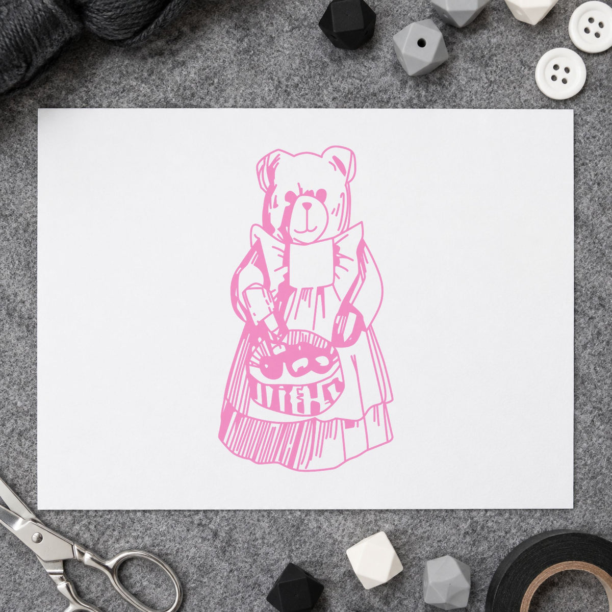 Country Bear with Produce Basket Rubber Stamp impression in pink ink on white paper in a styled craft setting.
